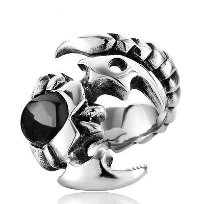 Silver charm with a black gemstone on a white background