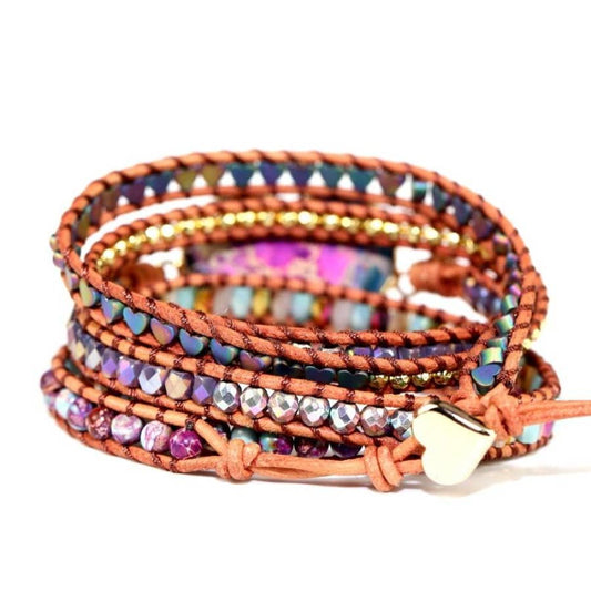 Multicolored beaded wrap bracelet with a heart charm on a white background