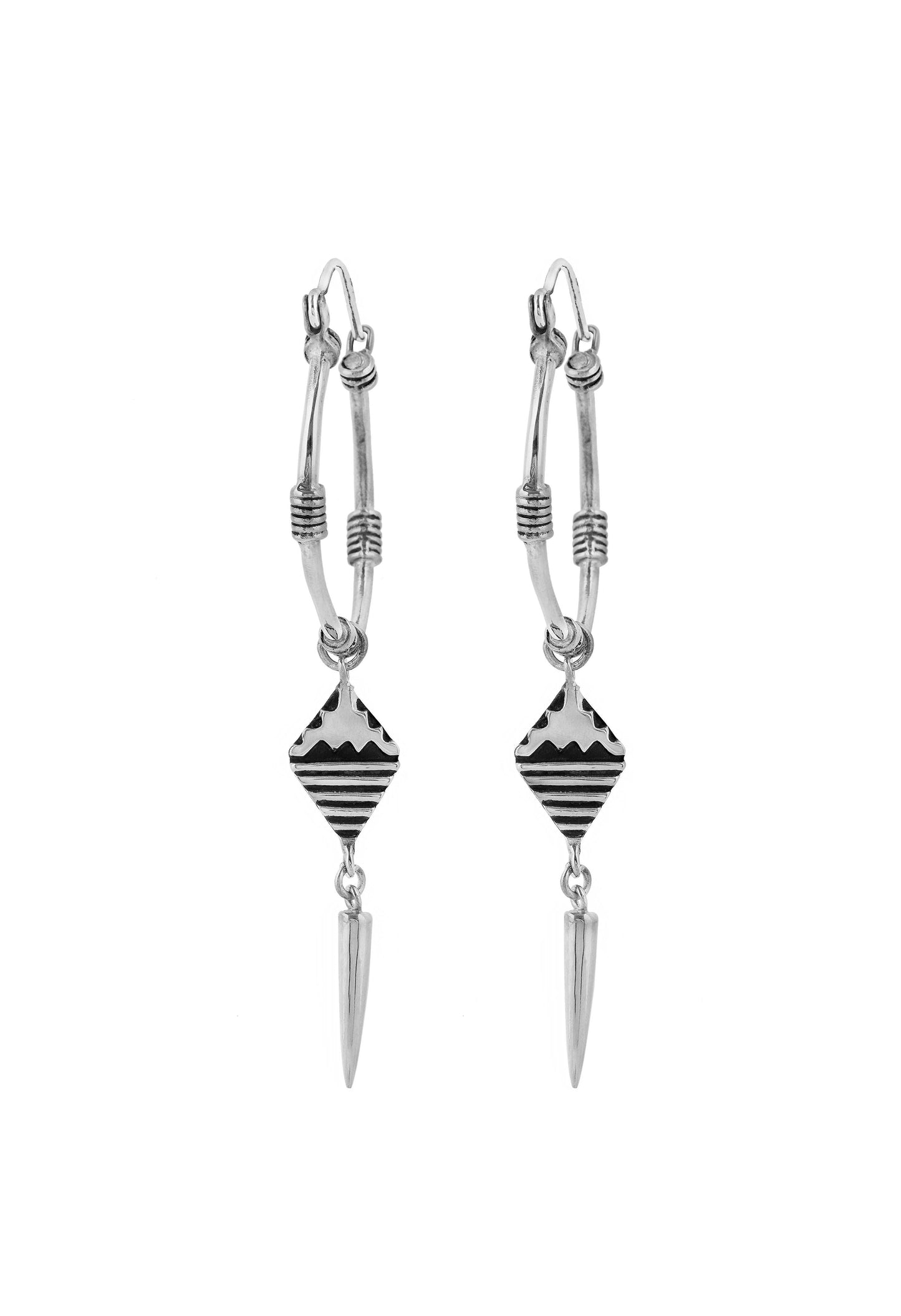Pair of silver earrings with geometric designs on a white background