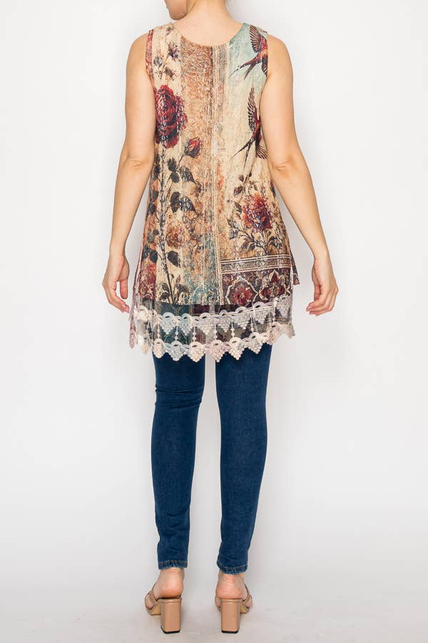 Person wearing a floral sleeveless top with lace trim and blue jeans on a white background