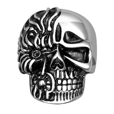 Silver skull ring with detailed design on a white background