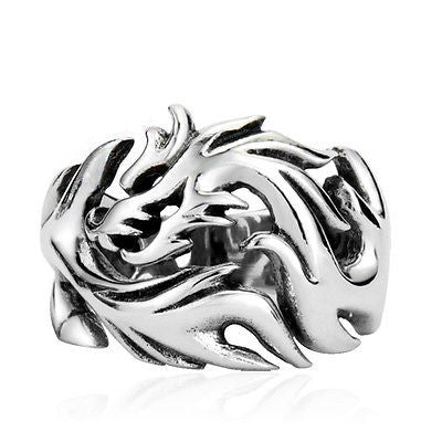 Silver dragon-shaped ring on a white background
