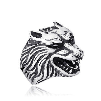 Silver lion head ring on a white background