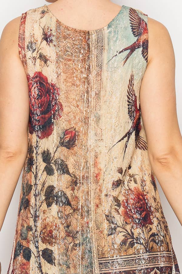 Sleeveless top with floral and bird pattern on a plain background