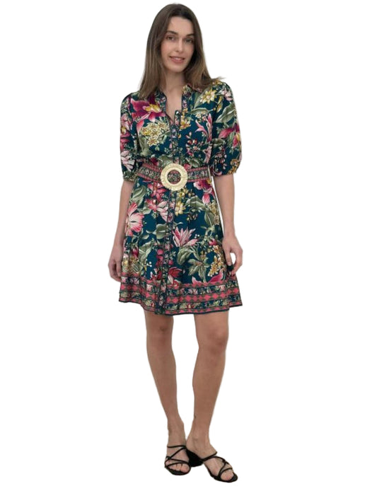 Woman wearing a floral dress with a belt on a white background