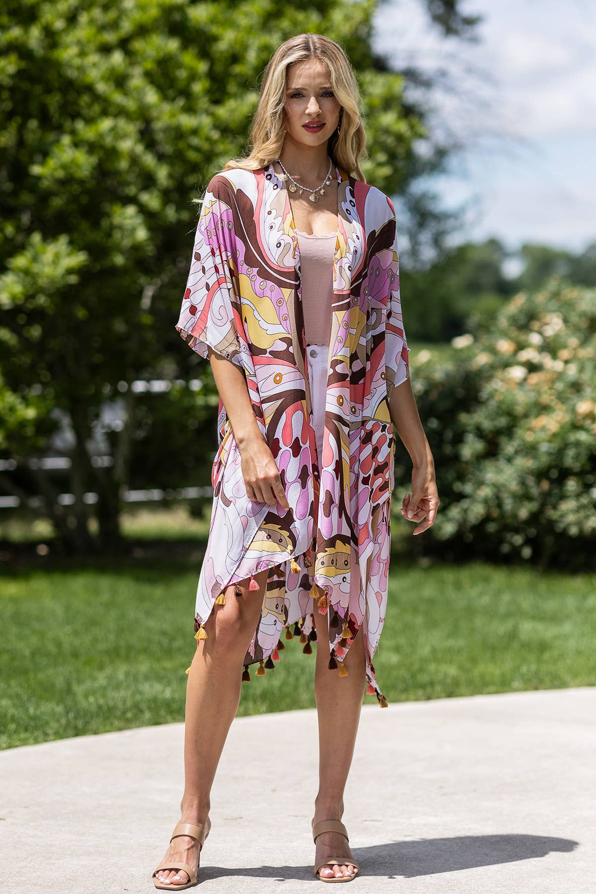 Woman wearing a colorful dress with a pattern in an outdoor setting
