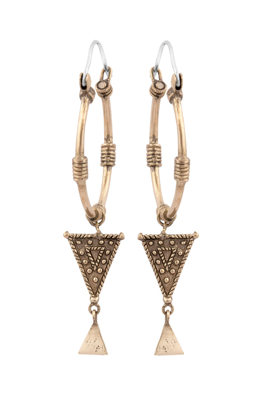 Pair of gold triangle earrings on a white background
