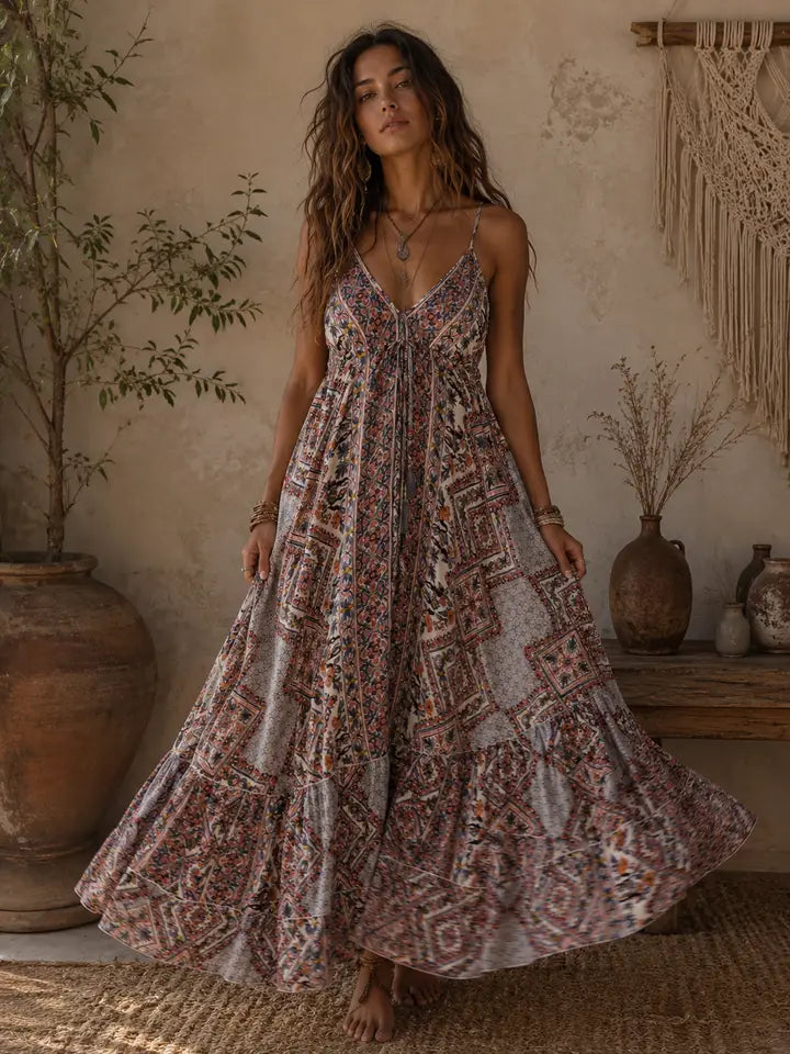 Woman wearing a patterned dress in a rustic interior setting