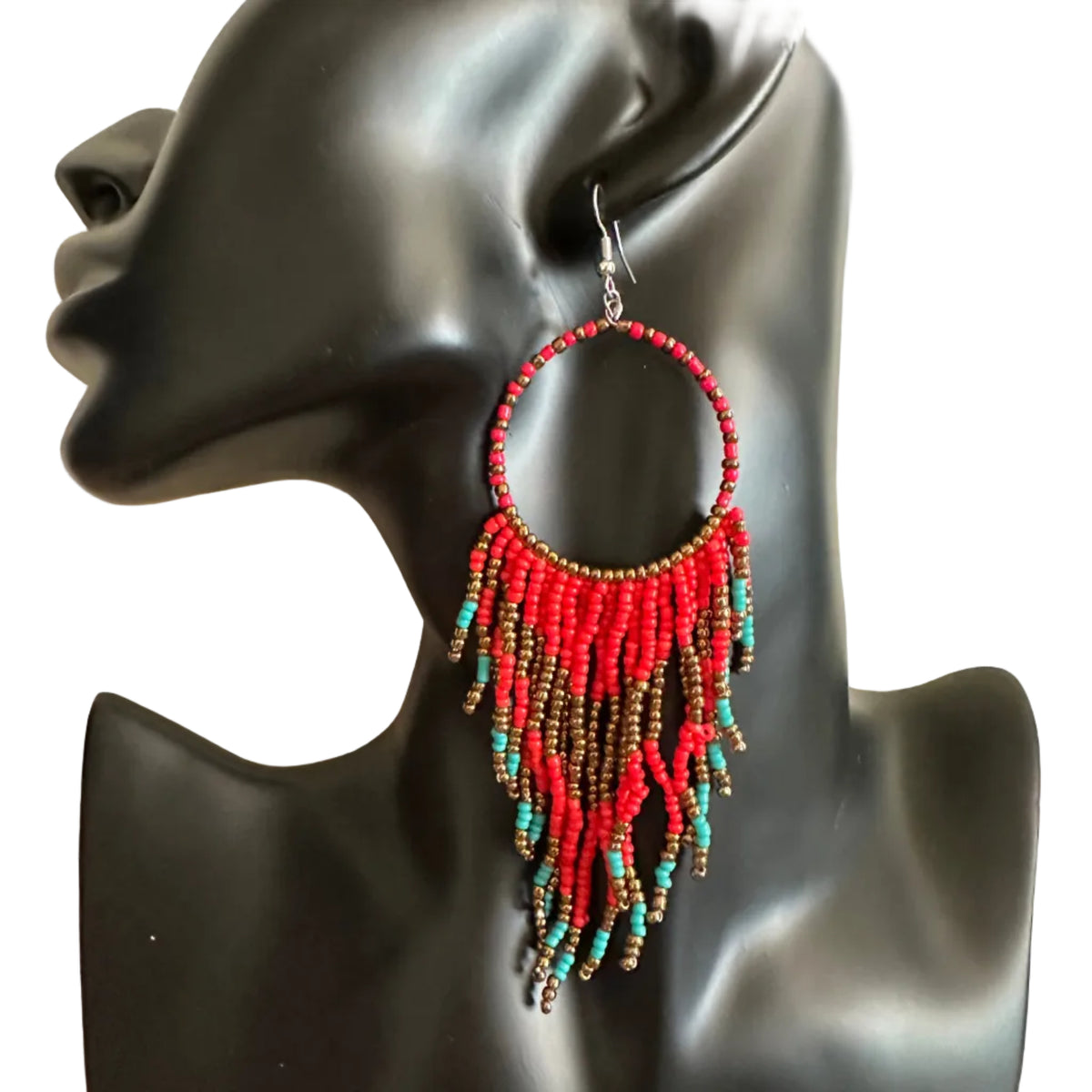 A single large hoop earring with dangling beaded fringe, displayed on a black mannequin bust. The earring features red beads, turquoise blue beads, and brown metallic beads, suspended from a silver hook.