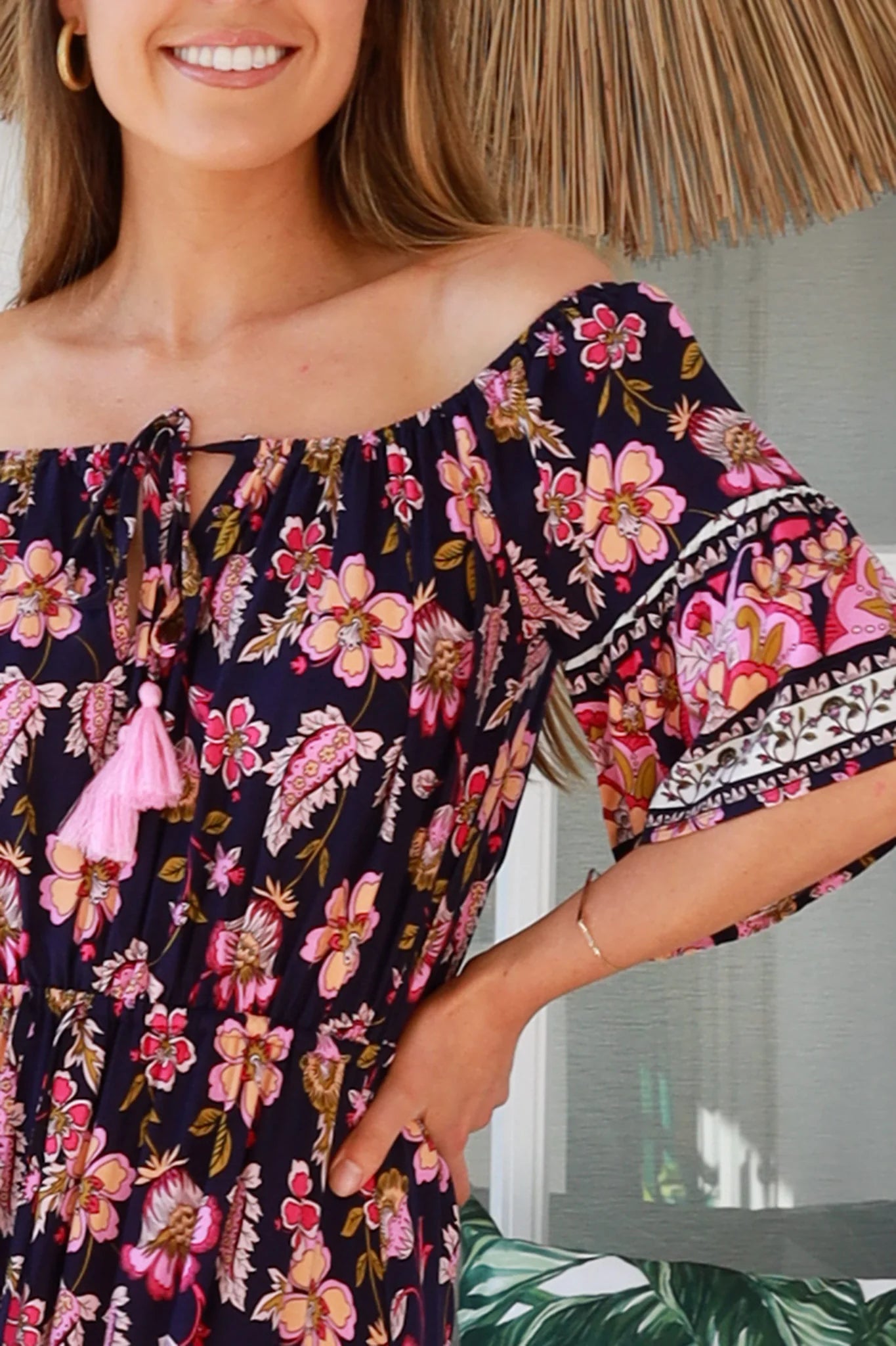 Woman wearing a floral dress with a blurred background