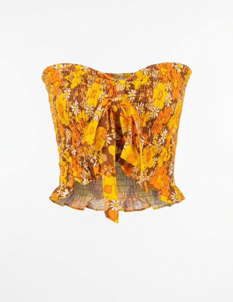 Yellow floral top on a white background