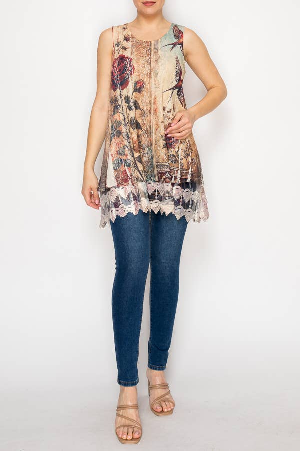 Woman wearing a floral sleeveless top and blue jeans on a white background