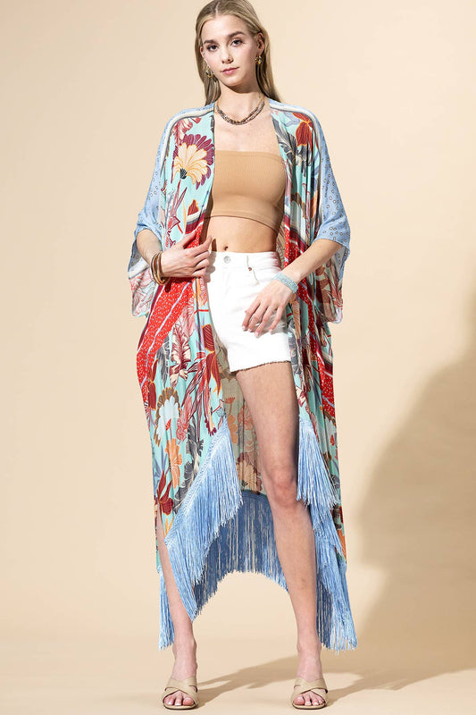 Woman wearing a colorful kimono-style garment with a beige background