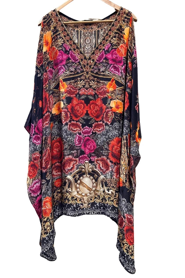 Colorful floral dress with intricate patterns on a white background