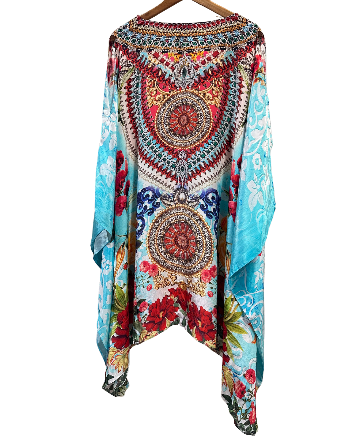 Colorful patterned garment on a hanger against a white background