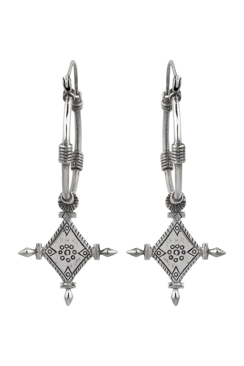 Pair of silver earrings with geometric designs on a white background