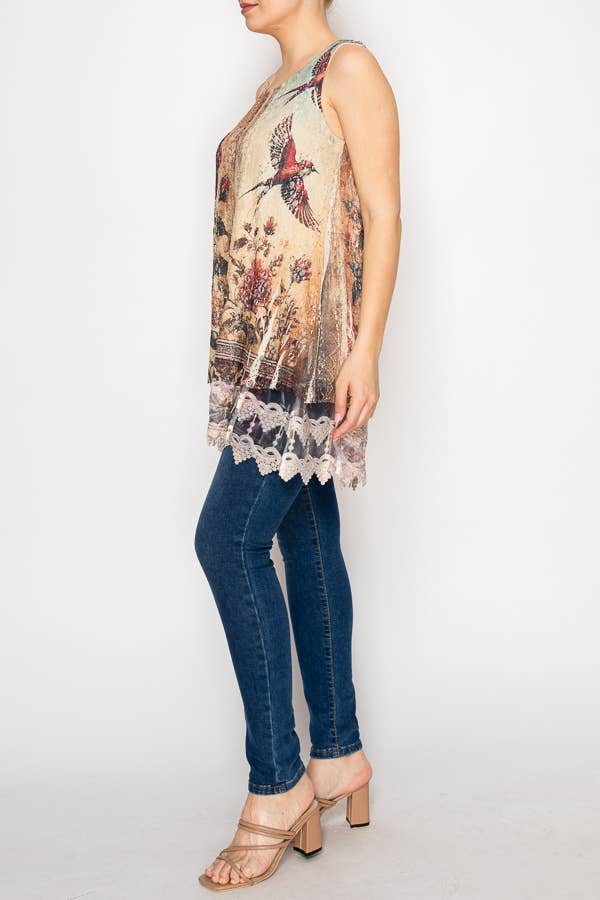 Woman wearing a sleeveless floral top and blue jeans on a white background