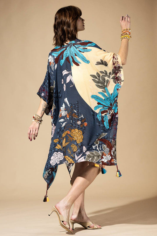 Woman wearing a floral kimono against a beige background