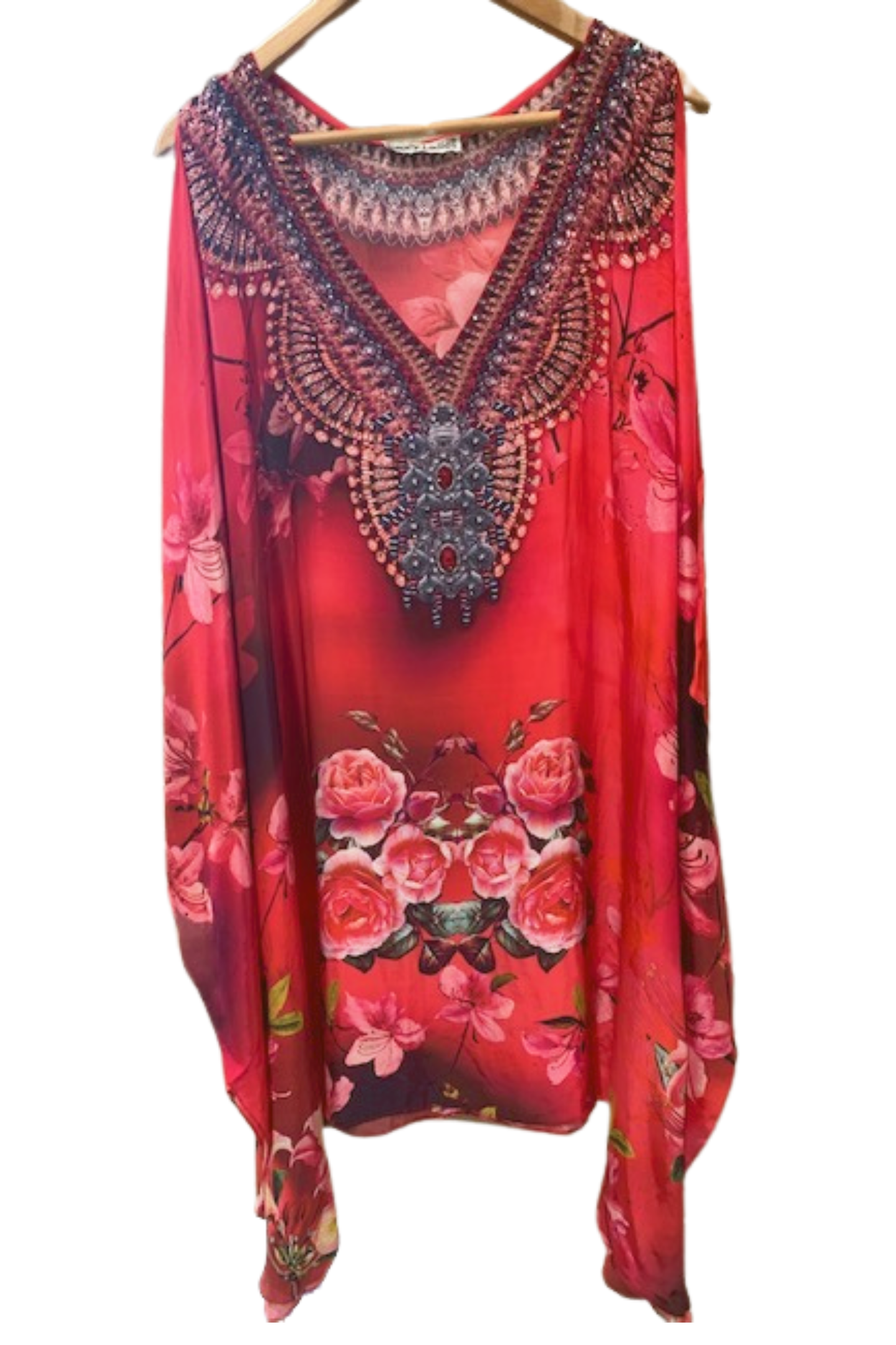 Red floral dress with intricate patterns on a hanger against a white background