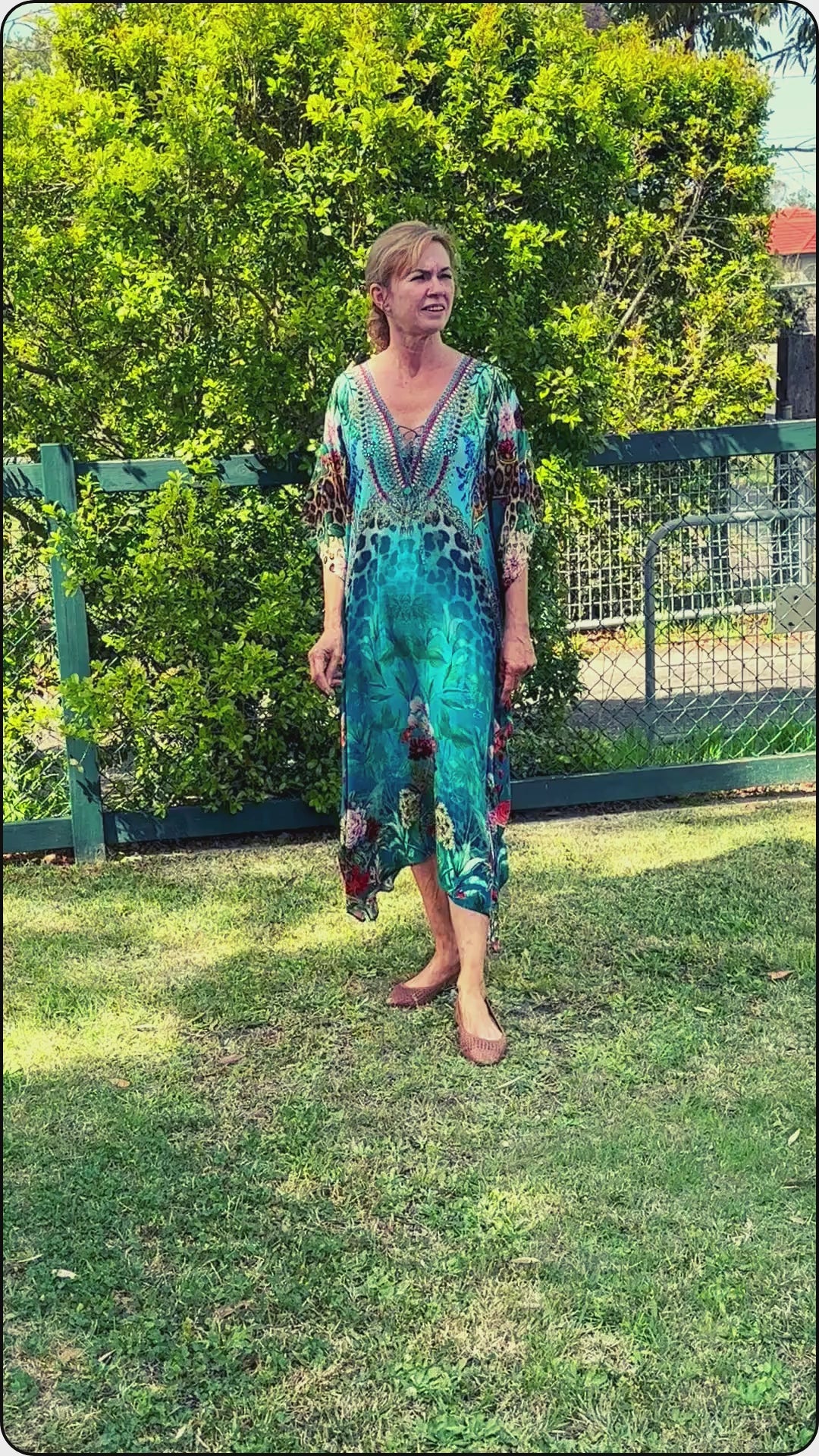 Women modelling a green teal kaftan